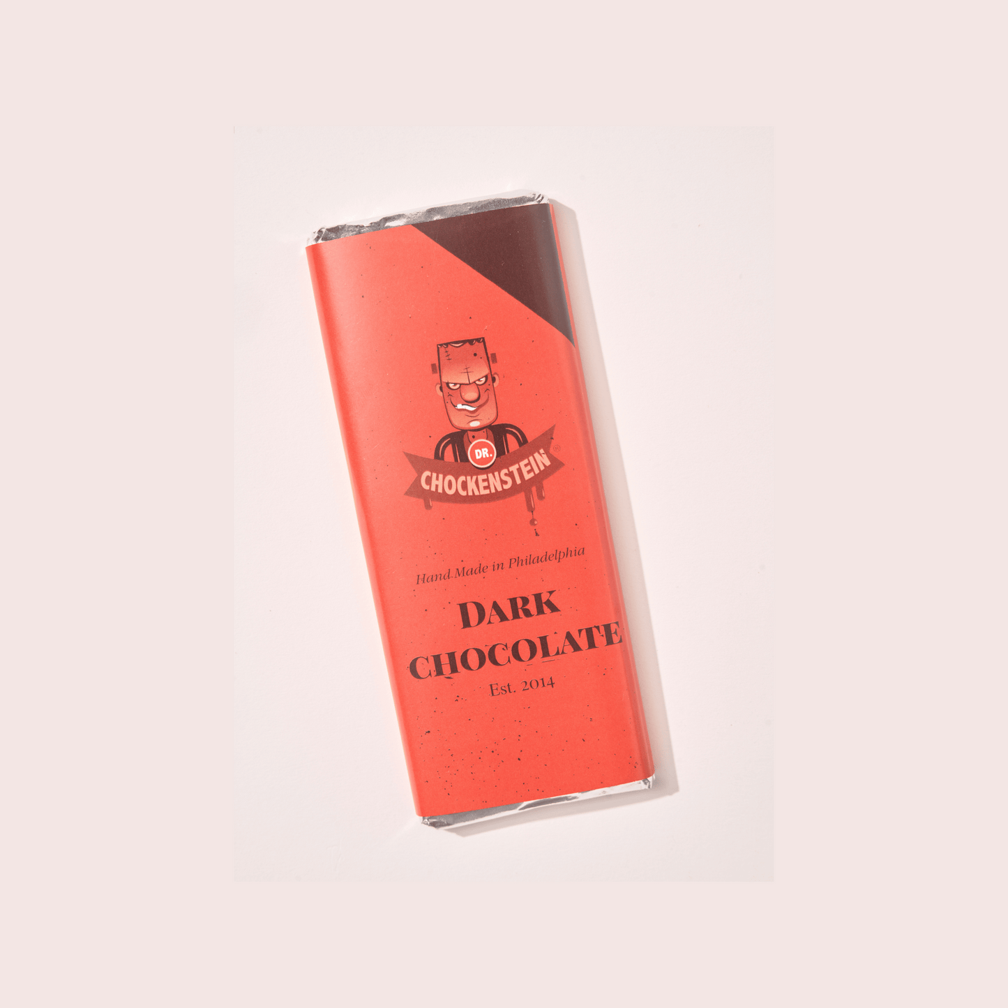 Dr. Chockenstein Dark Chocolate Bar featuring a smooth, velvety texture and premium chocolate.